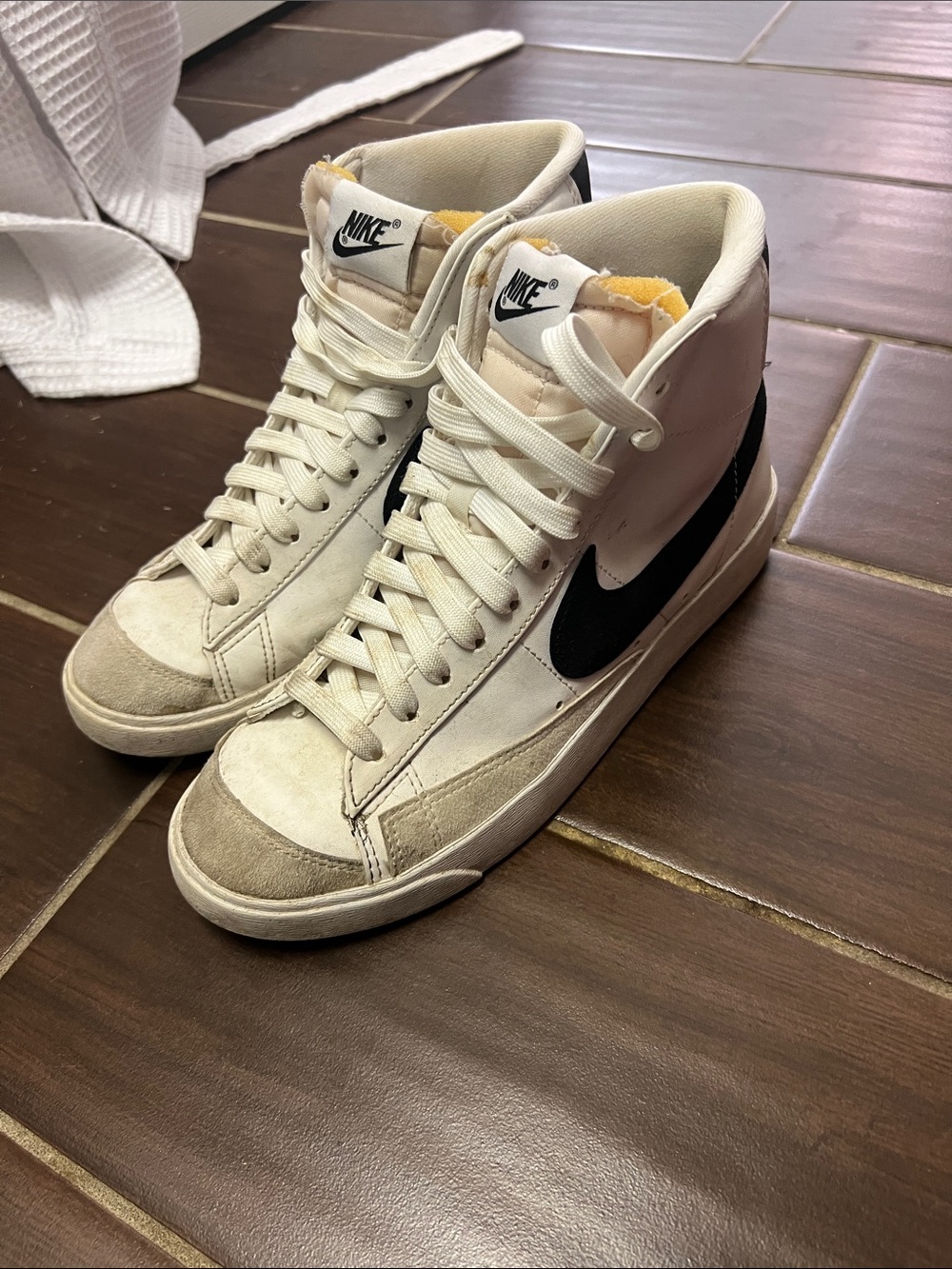 Nike High-Top Sneakers in Off-White with Black Swoosh
